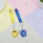 Stitch Theme Keychain with StrapKeychainsCRAFTY CUDDLETwo cartoon character keychains on a colorful geometric background1CartoonKeychain CuteKeyring MonsterKeychain KawaiiAccessories KidsBagCharm BackpackAccessory ReturnGifts TrendyKeychains SiliconeKeyring GiftForKids