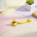 Stitch Theme Keychain with StrapKeychainsCRAFTY CUDDLEYellow keychain with cartoon character on a colorful surface1CartoonKeychain CuteKeyring MonsterKeychain KawaiiAccessories KidsBagCharm BackpackAccessory ReturnGifts TrendyKeychains SiliconeKeyring GiftForKids