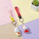 Cute Bunny KeychainKeychainsCRAFTY CUDDLETwo cartoon character keychains on a colorful background with a small plant.1BunnyKeychain CuteKeyring KawaiiAccessories GirlsBagCharm CartoonKeychain KidsReturnGifts BackpackCharm RabbitKeychain TrendyKeyrings GiftForGirls