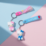 Hello Kitty Silicone KeychainKeychainsCRAFTY CUDDLETwo Hello Kitty keychains on a pink and blue background1CuteKeychain CartoonCat KawaiiAccessories KittyKeychain GirlsBagCharm BackpackCharm SiliconeKeychain ReturnGifts TrendyKeychains GiftForGirls