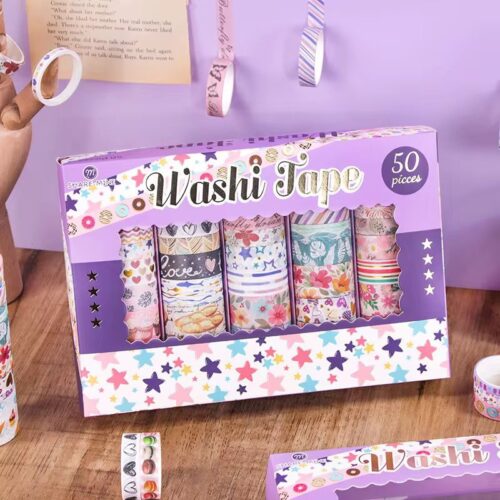 Box of washi tape with colorful designs on a wooden surface