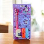 Packaged children's stationery set with cartoon characters on a blurred background