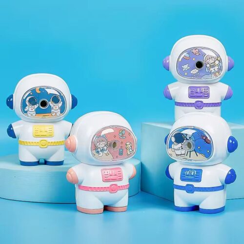 Four colorful astronaut-themed sharpeners on a blue background