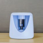 Electric Pencil SharpenerStationery > Erasers & SharpenersCRAFTY CUDDLEBlue pencil sharpener on a wooden surface with a gray backgroundBlueElectricSharpener StationeryEssentials SchoolSupplies StudyDesk OfficeSupplies BackToSchool SmartStationery DeskSetup StudentEssentials StationeryAddict