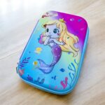 Deep Sea Mermaid Pencil CasePencil PouchCRAFTY CUDDLEColorful pencil case with mermaid design on a wooden surfaceMermaidPencilCase MermaidStationery GirlsSchoolSupplies EVAHardCase SchoolPencilBox CartoonPencilCase KidsStationery MermaidTheme BackToSchool CuteStationery