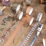 Vintage Travel Washi Tape Set - 24 RollsDecorative Washi TapeCRAFTY CUDDLECollection of decorative tapes on a wooden surfacewashitape vintagestationery traveltheme mapdesign journaling junkjournal scrapbooking plannerdecor artjournaling diysupplies aestheticstationery stationerylovers creativejournaling papercrafts stationeryaddict