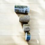 Vintage Text Washi Tape Set - 18 RollsDecorative Washi TapeCRAFTY CUDDLEFour rolls of decorative tape with newspaper print on a wooden surfacePast Events Boxwashitape washitapelove washitapeaddict vintagestationery retrostationery newspaperstyle journaling junkjournal scrapbooking artjournaling creativejournaling aestheticstationery stationerylovers