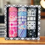 Washi Tape - 18 Rolls MulticolorDecorative Washi TapeCRAFTY CUDDLESet of colorful washi tape rolls in a decorative box on a wooden surface.washitape washitapelove washitapeaddict floralstationery botanicalstationery naturestationery journaling junkjournal scrapbooking artjournaling creativejournaling aestheticstationery stationerylovers