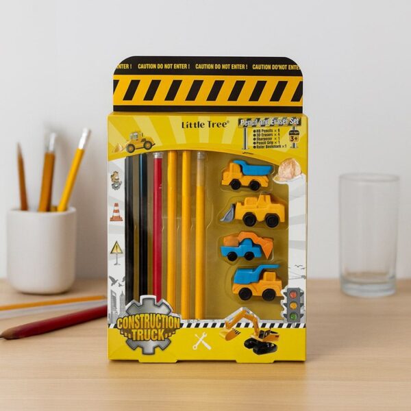 Packaged construction-themed pencils with toy truck figures on a light surface.