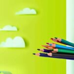 Bicolor Triangular Colour Pencils Pack of 12 (24 Shades)pencil colorsCRAFTY CUDDLEColorful pencils on a green background with cloud decorationscolouring pencils coloring supplies kids coloring tools art materials school art supplies colour pencil set color pencil pack student stationery