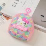 Mini Sequin Coin Pouch for KidsCoin pouchCRAFTY CUDDLEHello Kitty sequined pouch on a surface with books in the backgroundPinkSequinPouch CuteAccessories KidsAccessories CoinPouch GlitterPouch ReturnGiftIdeas KawaiiStyle MiniPouch StationeryLovers TrendyKids