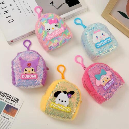 Five colorful sequin pouches with cartoon characters on a white surface.