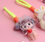 Cute Mini Doll Keychain for GirlsKeychainsCRAFTY CUDDLESmall doll with a transparent umbrella on a pink backgroundPeach Dress DollDollKeychain CuteAccessories GirlsAccessories BagCharm ReturnGiftIdeas KidsFashion KawaiiStyle PrincessTheme BirthdayReturnGift MiniDoll