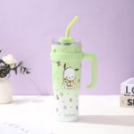 Sanrio Stainless Steel Insulated TumblerTumblersCRAFTY CUDDLEGreen tumbler with a handle and straw on a white surface with a purple backgroundLight GreenStainlessSteelTumbler InsulatedCup CuteDrinkware KawaiiStyle CartoonTumbler TravelMug HotAndCold ReusableCup AestheticVibes GiftIdeas