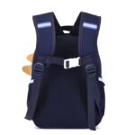 Dinosaur Cartoon School BackpackKids BagsCRAFTY CUDDLENavy blue backpack with white straps on a white background