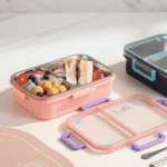 Dual Compartment Stainless Steel Lunch BoxStainless Steel Lunch BoxCRAFTY CUDDLEPink bento box with compartments filled with food on a white surfaceMint BlueBackToSchoolBentoBox