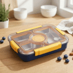 Stainless Steel Bento Lunch BoxStainless Steel Lunch BoxCrafty CuddleMeal prep container with compartments on a wooden tableYellowlunchbox bentobox kidslunchbox schoollunch bentolunchbox lunchboxideas leakprooflunchbox stainlesssteellunchbox schoolessentials kitchenessentials