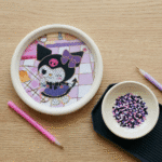 Sanrio Theme DIY Diamond Painting Coaster KitDIY KitsCrafty CuddleDIY kit with cartoon character and small bowl of colorful beads on a wooden surface.