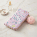 Cartoon Zipper Wallet with Pom PomPencil PouchCrafty CuddlePink wallet with cartoon character design on a light surfaceCinnamorollcutewallet kawaiiwallet girlswallet cartoonwallet cuteaccessories kawaiistyle girlsfashionaccessories trendingwallet giftforgirls cutekawaii