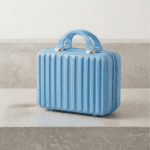 Mini Travel Organizer Case for KidsTravel BagsCrafty CuddleBlue suitcase with a textured surface on a neutral backgroundSky BlueKidsStorage MiniSuitcase KidsOrganizer ToyStorage StationeryOrganizer KidsTravelEssentials CuteStorageBox TravelOrganizer KidsAccessories KidsProducts