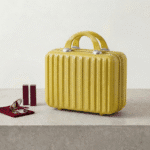 Mini Travel Organizer Case for KidsTravel BagsCrafty CuddleYellow suitcase with ribbed texture on a light surfaceYellowKidsStorage MiniSuitcase KidsOrganizer ToyStorage StationeryOrganizer KidsTravelEssentials CuteStorageBox TravelOrganizer KidsAccessories KidsProducts