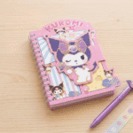 Cute Mini Diary with Sticker BookDiaryCrafty CuddleKuromi notebook with a pen on a wooden surfaceKuromiMiniDiary CuteStationery KidsNotebook StickerBook KawaiiStationery KidsStationery CartoonNotebook StationeryAddict CuteNotebooks StationeryLovers