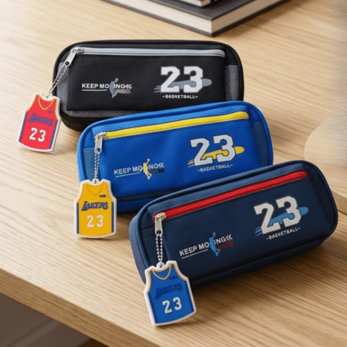 Three pencil cases with '23' branding on a wooden surface