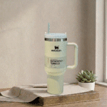 Stanley TumblerDrinkwareCrafty CuddleCream Stanley tumbler with a straw on a wooden surface with a plant in the backgroundStanley Tumbler-1CreamAestheticVibesAmazonFinds