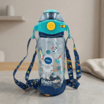 Children's water bottle with space-themed design and colorful straps on a neutral background
