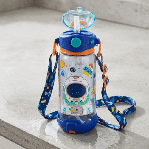 Children's water bottle with space-themed design and colorful strap on a light gray surface