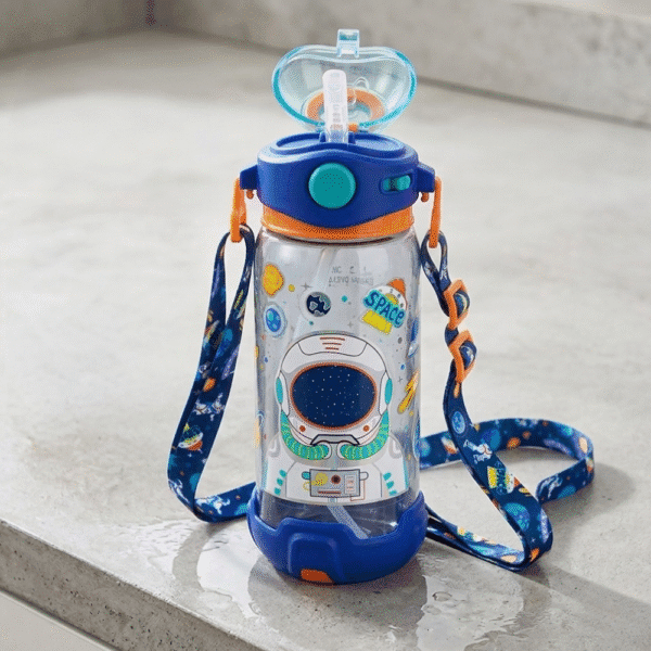 Children's water bottle with space-themed design and colorful strap on a light gray surface
