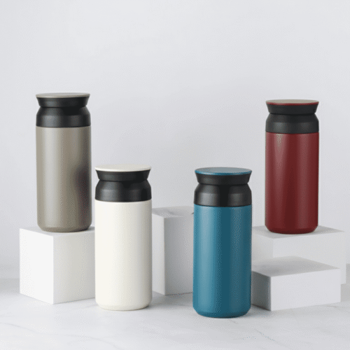 Four insulated travel mugs in different colors on a white background