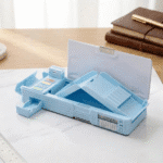 Blue pencil case with multiple compartments on a white surface