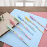 Rainbow Pens Pack of 66 Rainbow PensCrafty CuddleSet of colorful gel pens on a notebook with a light backgroundRainbow pensart suppliesbullet journaling