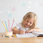Magical Unicorn PenCrafty CuddleChild coloring with unicorn - themed pencils on a light background1