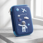 Blue pencil case with space-themed design featuring an astronaut and space elements on a light gray surface.