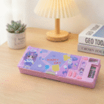 Smart Pencil Box with CalculatorPencil BoxCrafty CuddlePink pencil case with cartoon designs on a wooden deskPinkpencilbox kidsstationery multifunctionpencilbox cartoonpencilcase schoolstationery kidsstudyessentials stationeryforkids cutestationery backtoschool studentstationery