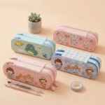 Four colorful pencil cases with cartoon designs on a beige background
