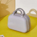 Hard Shell Multi - Purpose Travel Organizer CaseTravel BagsCrafty CuddleSmall gray suitcase on a yellow surface with a white backgroundGreyTravelOrganizer MultipurposeOrganizer StorageCase TravelEssentials KidsOrganizer StationeryStorage MakeupOrganizer PortableOrganizer HardShellCase TravelStorage