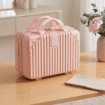 Cute Mini Suitcase Storage CaseTravel BagsCrafty CuddlePink suitcase on a wooden table with a vase of flowers in the backgroundPinkKidsStorage MiniSuitcase KidsOrganizer CuteStorageBox KidsTravelEssentials StationeryOrganizer ToyStorage KidsAccessories TravelOrganizer CuteKidsProducts
