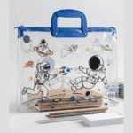 Transparent Kids Document BagKids BagsCrafty CuddleClear pouch with astronaut design and blue handle on a light gray backgroundAstronautKidsFileBag CartoonStationery KidsOrganizer SchoolSupplies CuteStationery KidsDocumentBag StationeryLovers KidsSchoolEssentials A4FileBag TransparentBag