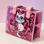 Transparent Holographic Kids Tote BagKids BagsCrafty CuddlePink transparent bag with cat illustration and 'Field of Cats' branding on a pink backgroundPinkKidsToteBag CuteKidsBag CartoonToteBag UnicornBag KidsSchoolBag HolographicBag KidsStationeryBag CuteCarryBag KidsAccessories StationeryLovers