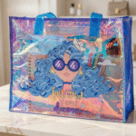 Transparent Holographic Kids Tote BagKids BagsCrafty CuddleHolographic tote bag with a design of a person with blue hair and sunglasses, and the text 'Follow Your Dreams'.BlueKidsToteBag CuteKidsBag CartoonToteBag UnicornBag KidsSchoolBag HolographicBag KidsStationeryBag CuteCarryBag KidsAccessories StationeryLovers