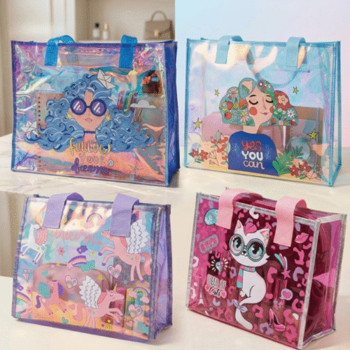 Four colorful tote bags with cartoon characters and motivational phrases on a white surface.