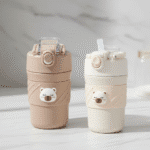 Cute Bear Vacuum CupBear Tumbler with StrawCrafty CuddleTwo bear - themed water bottles on a light surface with a neutral backgroundCream450ml water bottleanti spill bottle