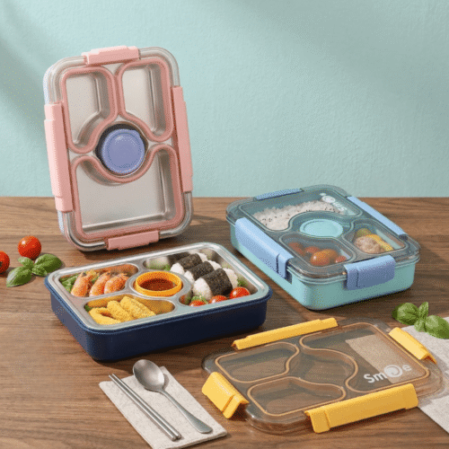 Three bento boxes with compartments filled with food on a wooden table.