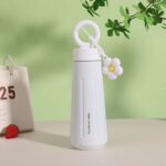 Stainless Steel Water Bottle with HandleCartoon Kids Water BottleCrafty CuddleWhite insulated bottle with a floral design on a light green backgroundWhite
