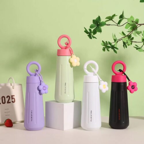 Four colorful water bottles with unique designs on a light green background