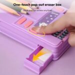 Smart Pencil Box with CalculatorPencil BoxCrafty CuddlePurple one - touch pop - out eraser box with a hand pressing a button to open it, on a pink background.Purplepencilbox kidsstationery multifunctionpencilbox cartoonpencilcase schoolstationery kidsstudyessentials stationeryforkids cutestationery backtoschool studentstationery