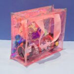 Transparent Holographic Kids Tote BagKids BagsCrafty CuddleClear pink bag with colorful contents against a blue backgroundLight BlueKidsToteBag CuteKidsBag CartoonToteBag UnicornBag KidsSchoolBag HolographicBag KidsStationeryBag CuteCarryBag KidsAccessories StationeryLovers
